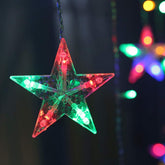 Star-shaped LED light ornament with multicolor lights on a dark background